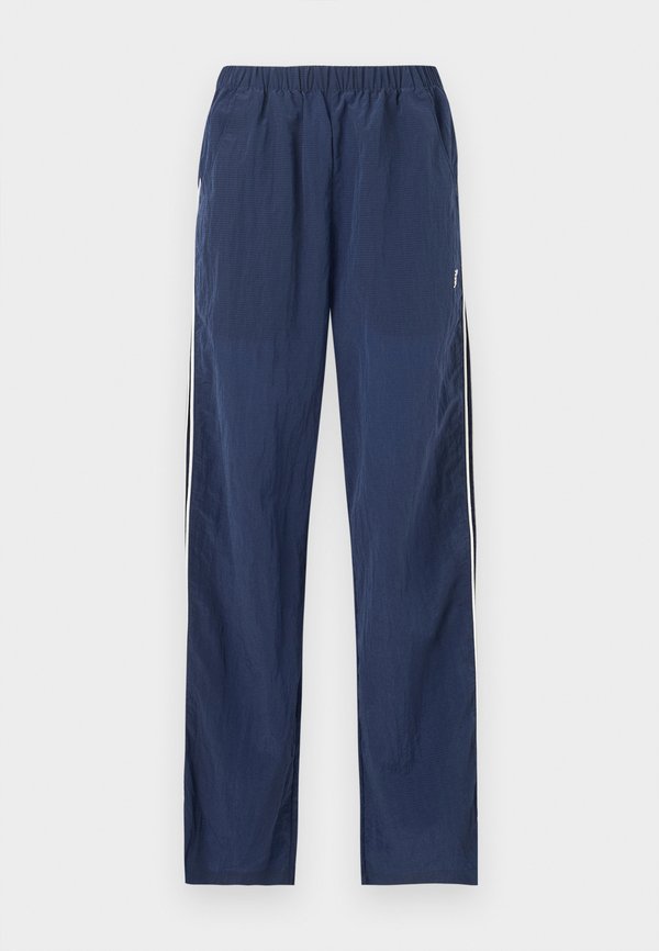 New Balance SPORT LEGACY - Tracksuit bottoms - navy