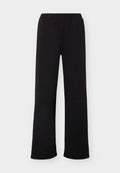 Under Armour MOTION WIDE LEG - Tracksuit bottoms - ultimate black/white