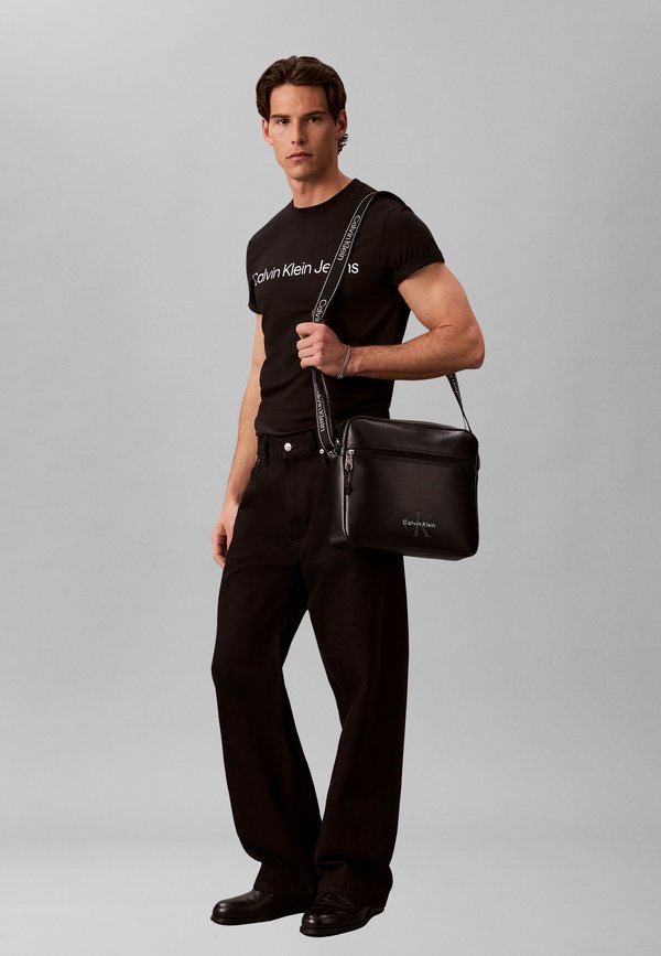 Calvin Klein LOGO FLIGHT BAG - Cross body bag - black