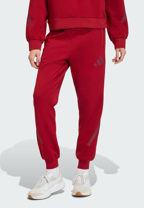 adidas Sportswear ADIDAS Z.N.E. - Tracksuit bottoms - active maroon