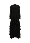 Schwarzes Maxikleid mit langen Ärmeln, hohem Ausschnitt, geschichteten Rüschen und einem asymmetrischen Saumdesign. Hergestellt aus leichtem Stoff.