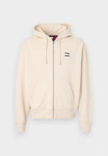 Beige Zip-Hoodie aus Baumwollmischung. Mit einem Kordelzug an der Kapuze, Fronttaschen, gerippten Bündchen und einem kleinen Logo auf der Brust.