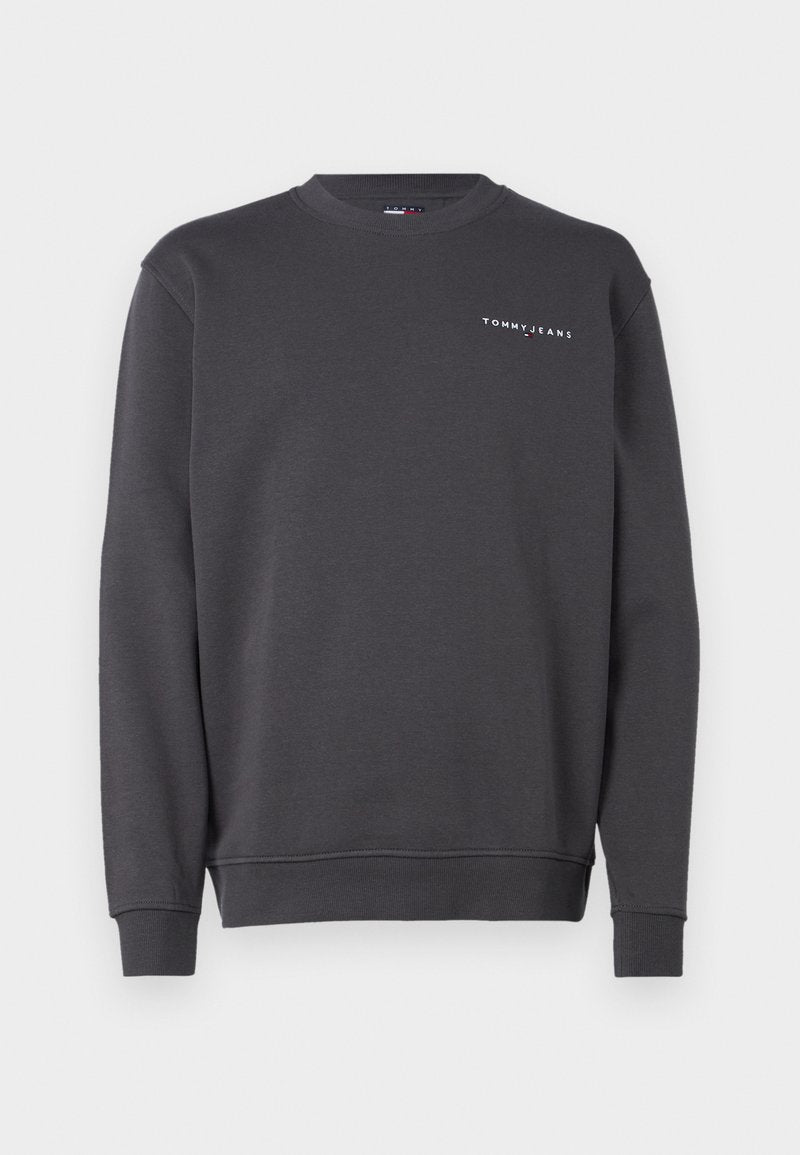 Grauer Pullover aus weichem Baumwollmix, mit Rundhalsausschnitt und gerippten Bündchen. Auf der linken Brust befindet sich ein weißer Logotext.