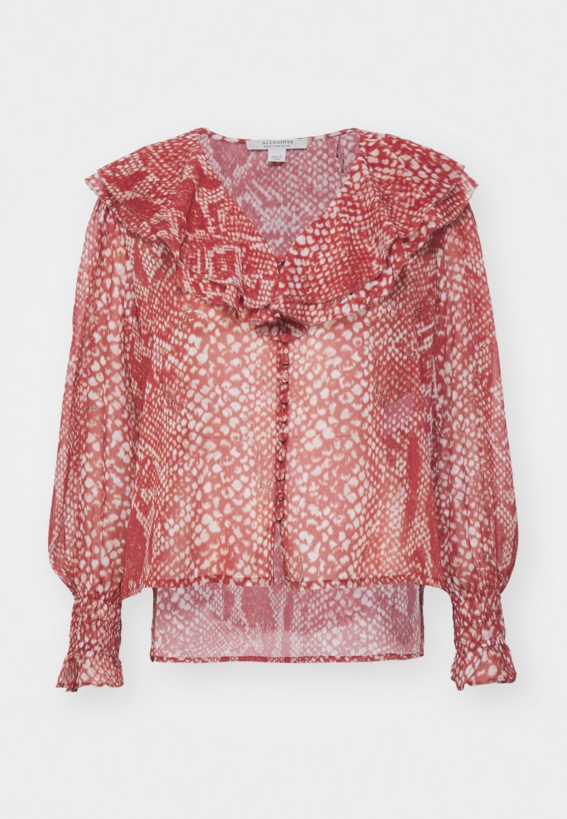 Rote durchsichtige Bluse mit einem rüschengeschmückten Kragen, langen Puffärmeln mit elastischen Bündchen und einer Knopfleiste. Mit hellen und dunklen Punkten gemustert.