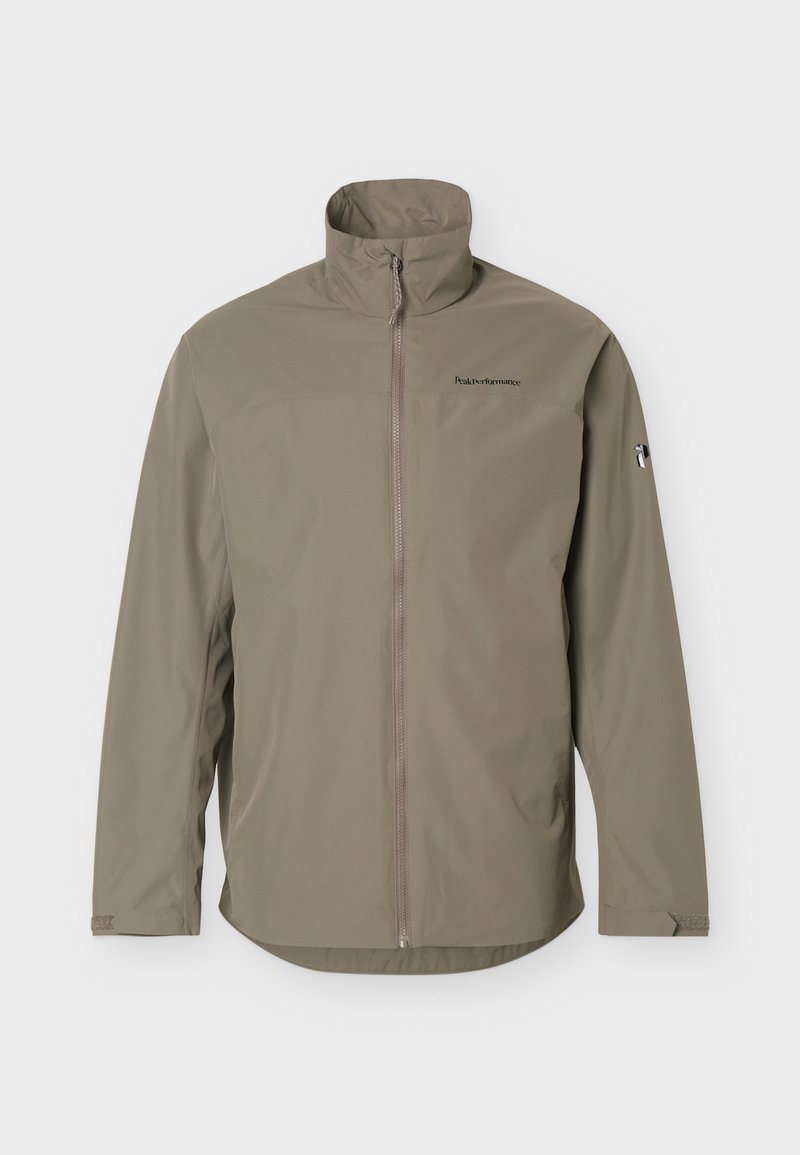 Hellbraune Jacke mit Reißverschluss, hohem Kragen, langen Ärmeln und kleinen Logos auf der Brust und am linken Ärmel.