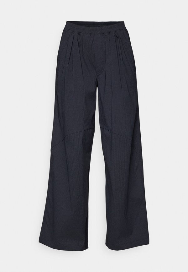 Under Armour UNSTOPPABLE WOVEN - Trousers - black