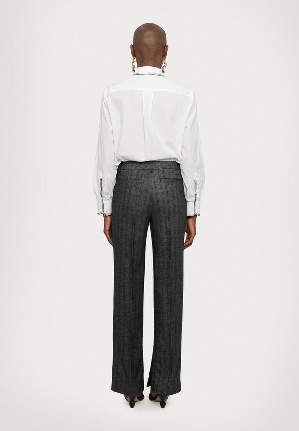 REMAIN STRIPED SLIM PANTS