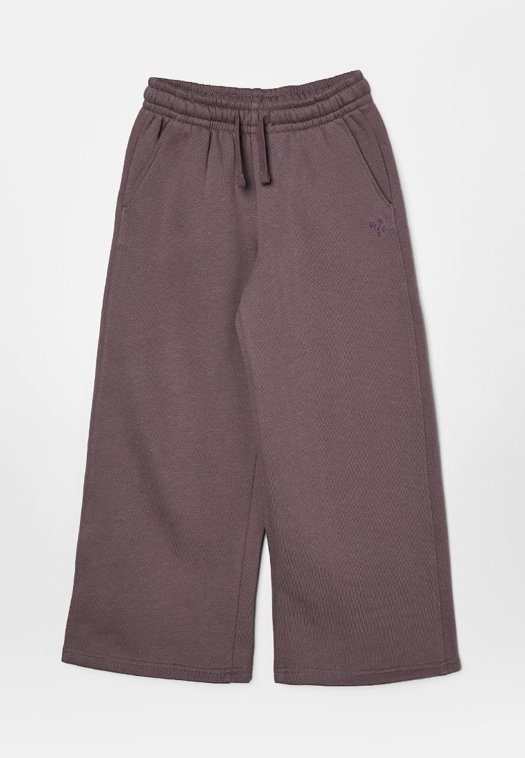 Lila Jogginghosen aus strukturiertem Stoff, mit einem elastischen Bund, seitlichen Taschen und einem legeren, weit geschnittenen Design.