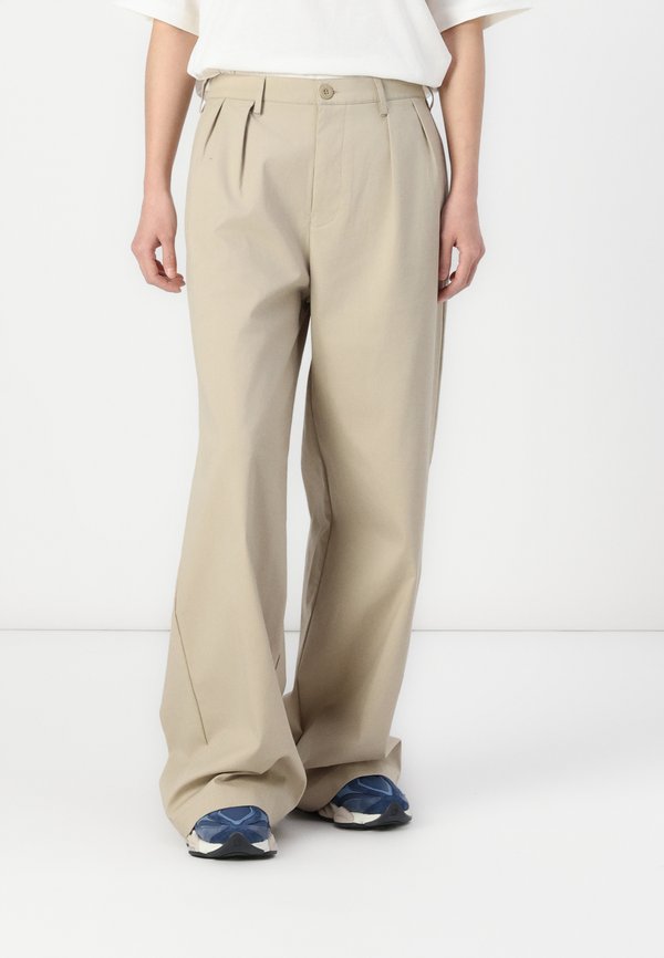 New Balance BOYLSTON - Trousers - stoneware