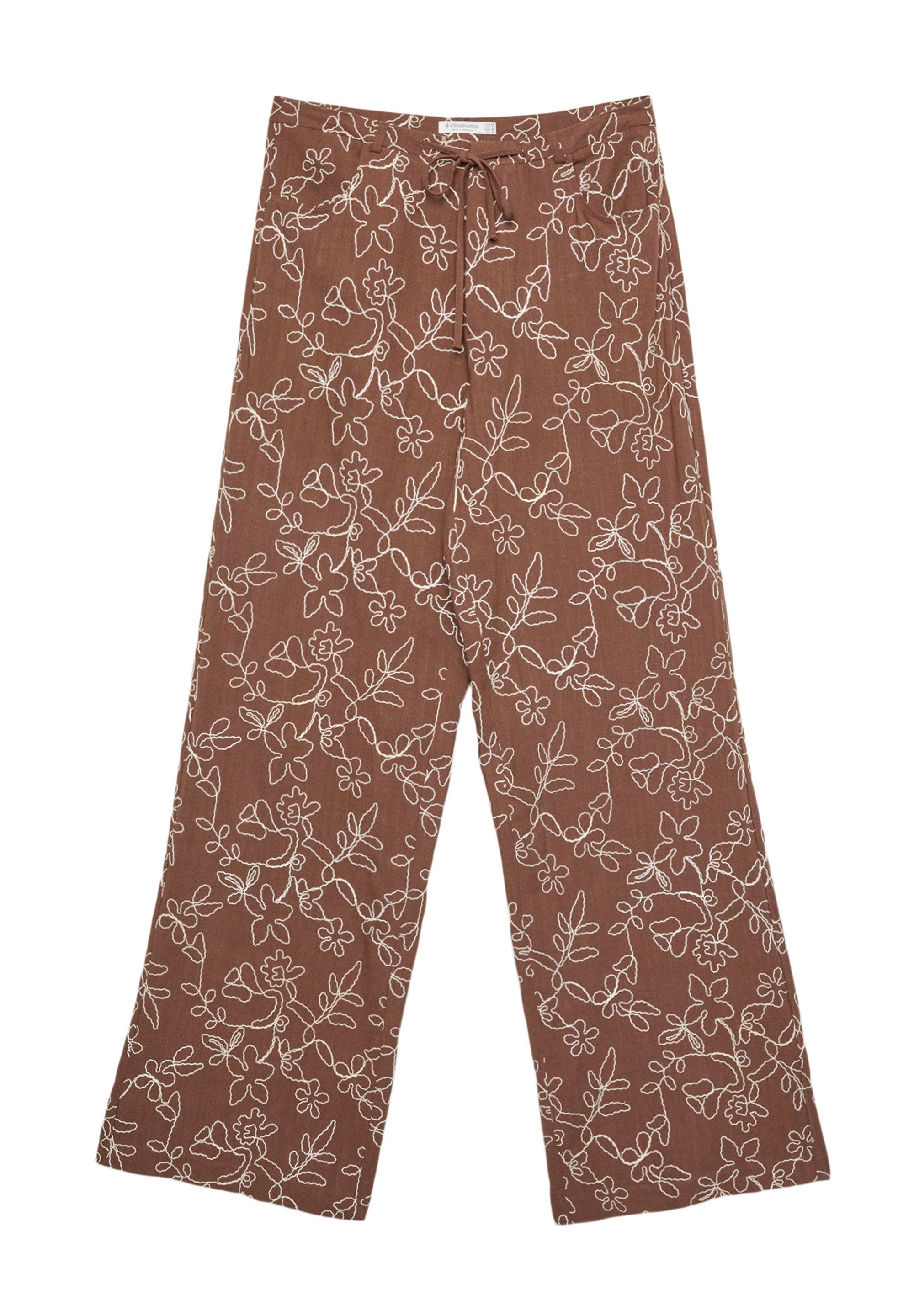 Braune Leinenhose mit weißer Blumenstickerei, ausgestattet mit einem Kordelzugbund und weit geschnittenem Design für Komfort und Atmungsaktivität.