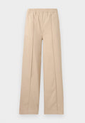 Beige weite Hosen mit elastischem Bund, ausgestattet mit zwei vertikalen Falten, aus weichem Stoff und in einem schlichten Design.