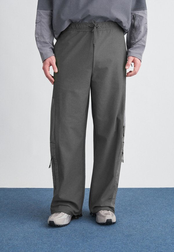 Nike Sportswear Tracksuit bottoms - iron grey/pencil point/black