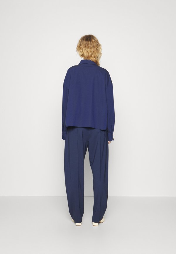 A.W.A.K.E. MODE TAPERED PANTS WITH VERTICAL SLIT KNEES