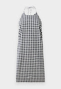 Halterneck-Kleid im Schwarz-Weiß-Karomuster, mit lockerer Passform und Bindebändern am Hals. Leichter Stoff.