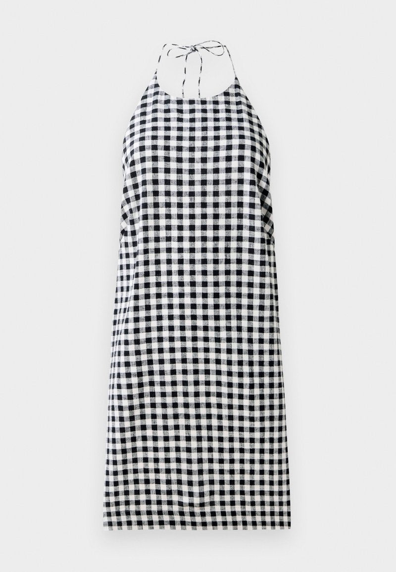 Halterneck-Kleid im Schwarz-Weiß-Karomuster, mit lockerer Passform und Bindebändern am Hals. Leichter Stoff.