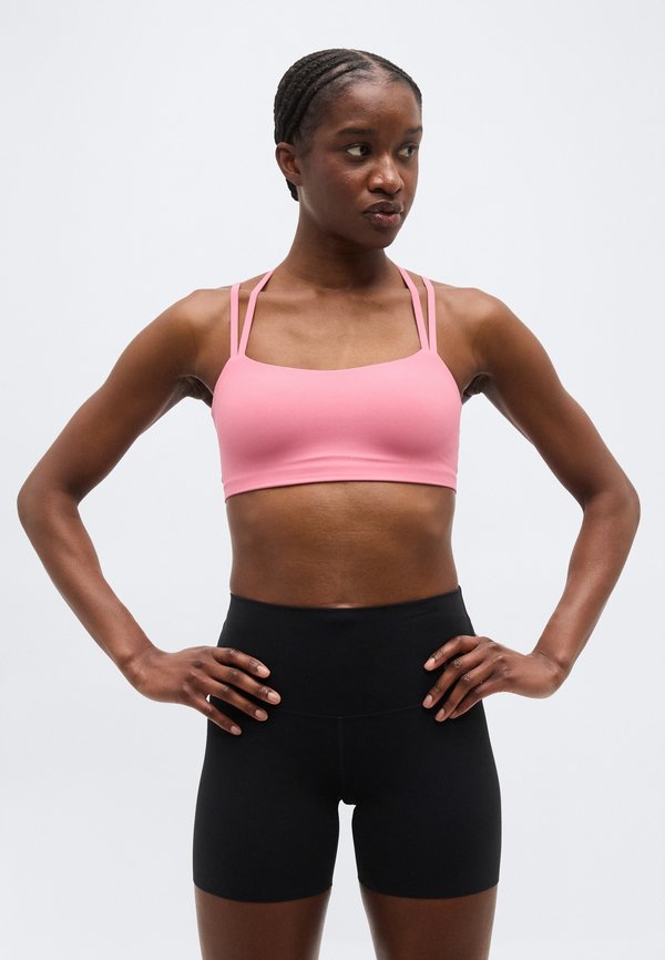 Nike Performance ZENVY STRAPPY BRA - Light support sports bra - peony/white