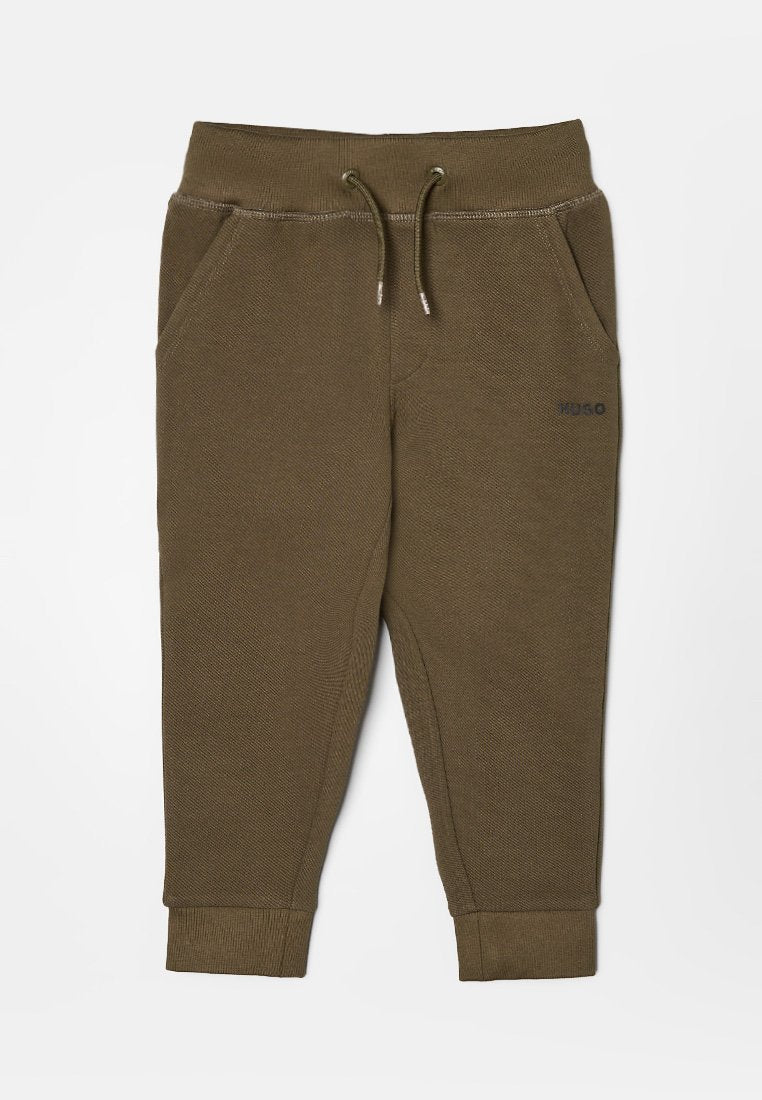 Olivgrüne Jogginghosen für Kinder mit elastischem Bund, Kordelzug, Seitentaschen und gerippten Bündchen an den Knöcheln.