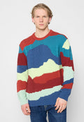 Gestrickter Pullover mit strukturisiertem Muster in Blau, Rot, Grün und Cremefarben, mit rundem Ausschnitt und langen Ärmeln.