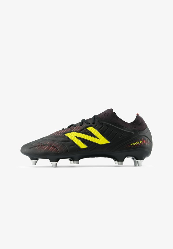 New Balance TEKELA PRO LOW SG V5 - Trainers - black punch yellow