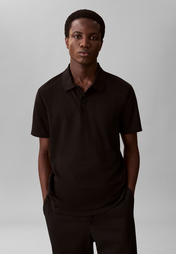 Calvin Klein TECH INTERLOCK COLLECTION - Polo shirt - black