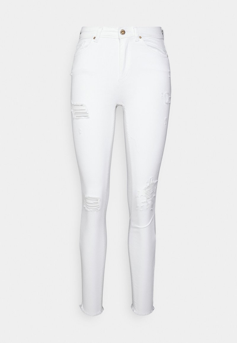 Weiße, enganliegende Jeans aus Denim mit abgewetzten Patches, ausgefranstem Saum und klassischem Fünf-Taschen-Design. Mit Knopfverschluss und Gürtelschlaufen.