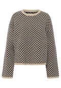 Beige gestrickter Pullover mit einem marineblauen Fischgrätmuster, geripptem Ausschnitt und Bündchen. Kürzere Länge mit langen, leicht weit geschnittenen Ärmeln.