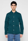 Türkise Leinwandjacke mit durchgehender Knopfleiste, spitzem Kragen, vier Taschen und langen Ärmeln. Strukturierter Stoff mit lockerem Schnitt.