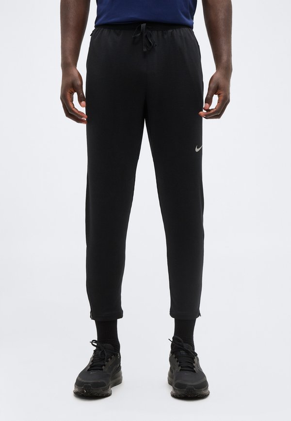 Nike Performance STRIDE - Tracksuit bottoms - black