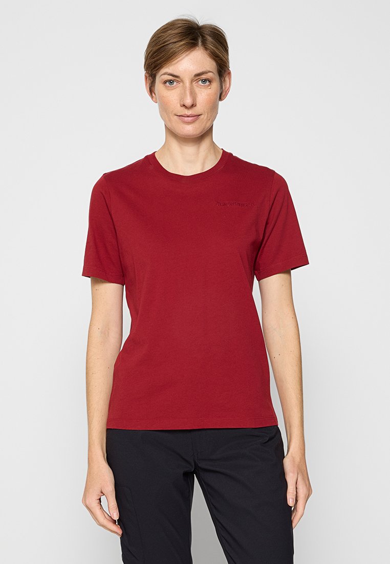Burgunderfarbenes T-Shirt mit kurzen Ärmeln aus weicher Baumwolle, mit Rundhalsausschnitt und minimalem Branding auf der Brust. Glatte Textur, lässige Passform.
