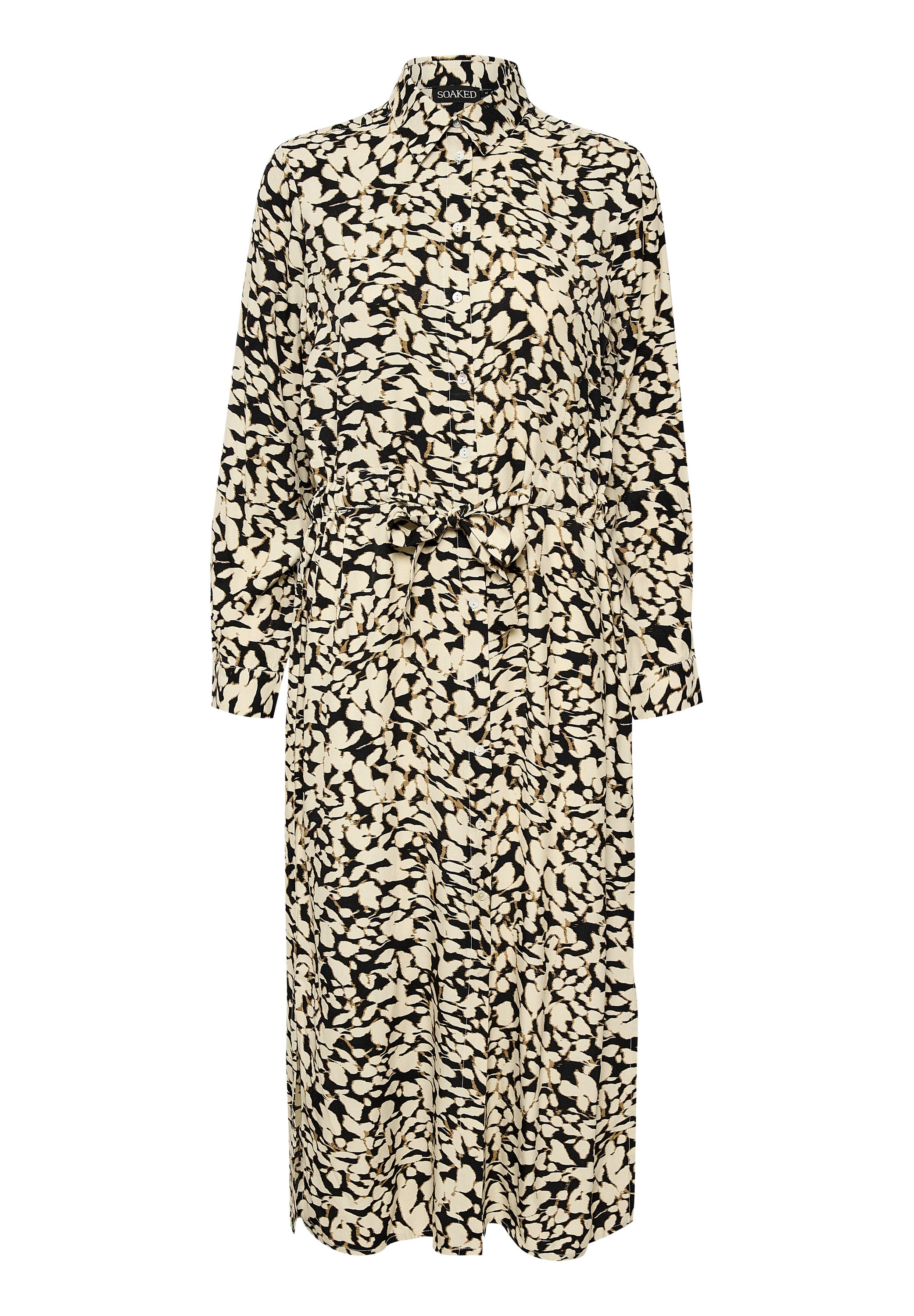 Schwarz-weiß gemustertes Kleid mit kragenartiger Ausschnitt, langen Ärmeln, Knopfverschluss und einem Bindegürtel in der Taille. Aus leichtem Stoff gefertigt.