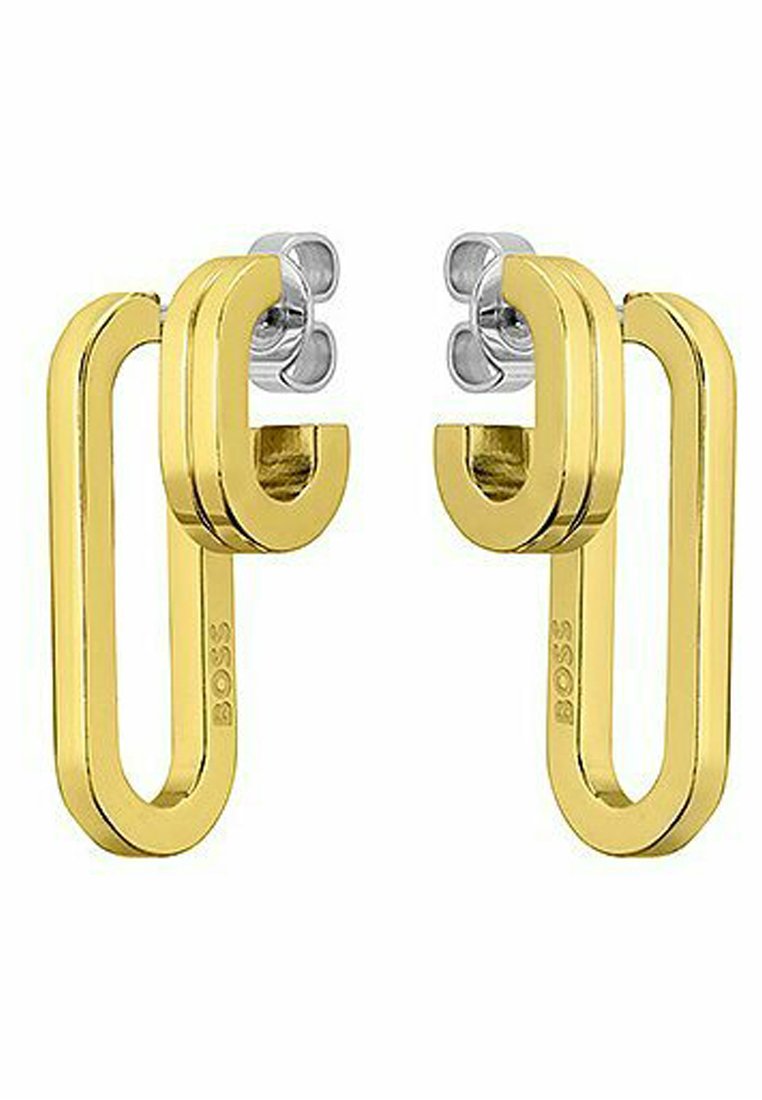 Goldfarbene Metallohrringe mit modernem, geometrischem Design in Form einer Schlaufe und silbernen Akzenten an der Oberseite. Markenlogo sichtbar.