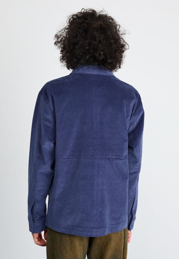 New Balance OVERSHIRT