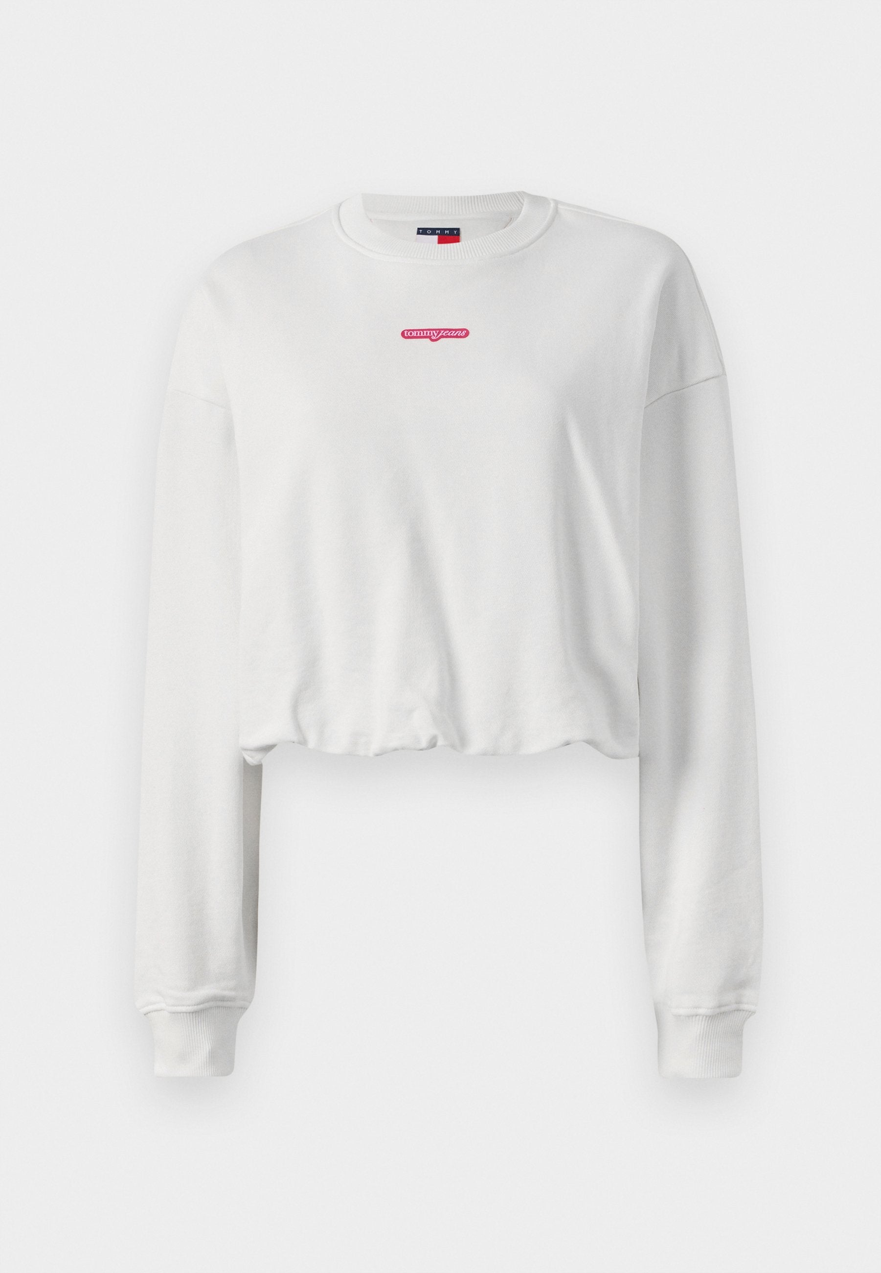 Weiße, kurze Sweatshirt-Jacke aus weichem Stoff, mit langen Ärmeln und einem roten Logo "tommy jeans" in der Mitte der Brust.