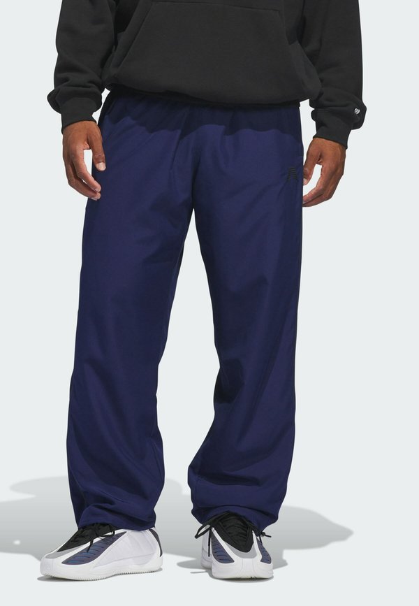 adidas Performance ANTHONY EDWARDS FOUNDATION  - Tracksuit bottoms - dark blue