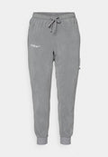 Graue Jogginghosen aus weichem Fleece, mit einem elastischen Taillenbund, Kordelzug und gerippten Bündchen. Enthält die Logos von "BARÇA" und "Nike".