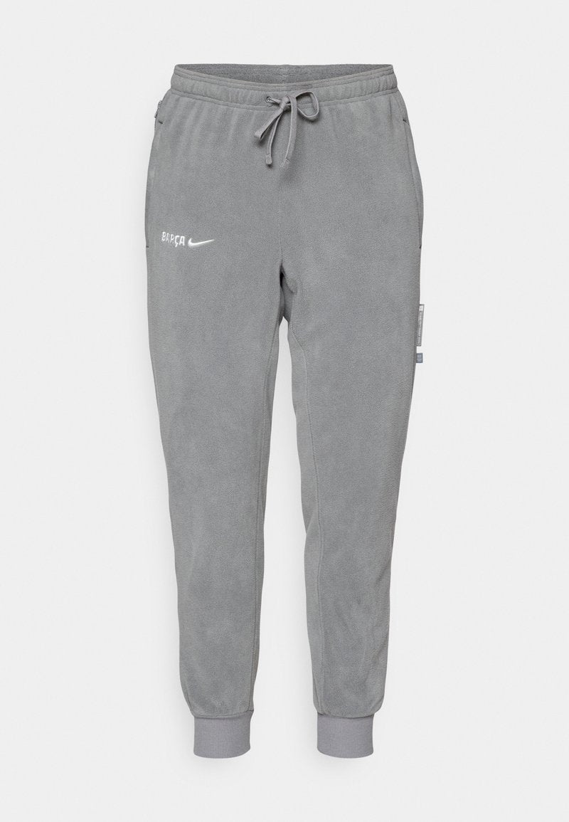 Graue Jogginghosen aus weichem Fleece, mit einem elastischen Taillenbund, Kordelzug und gerippten Bündchen. Enthält die Logos von "BARÇA" und "Nike".