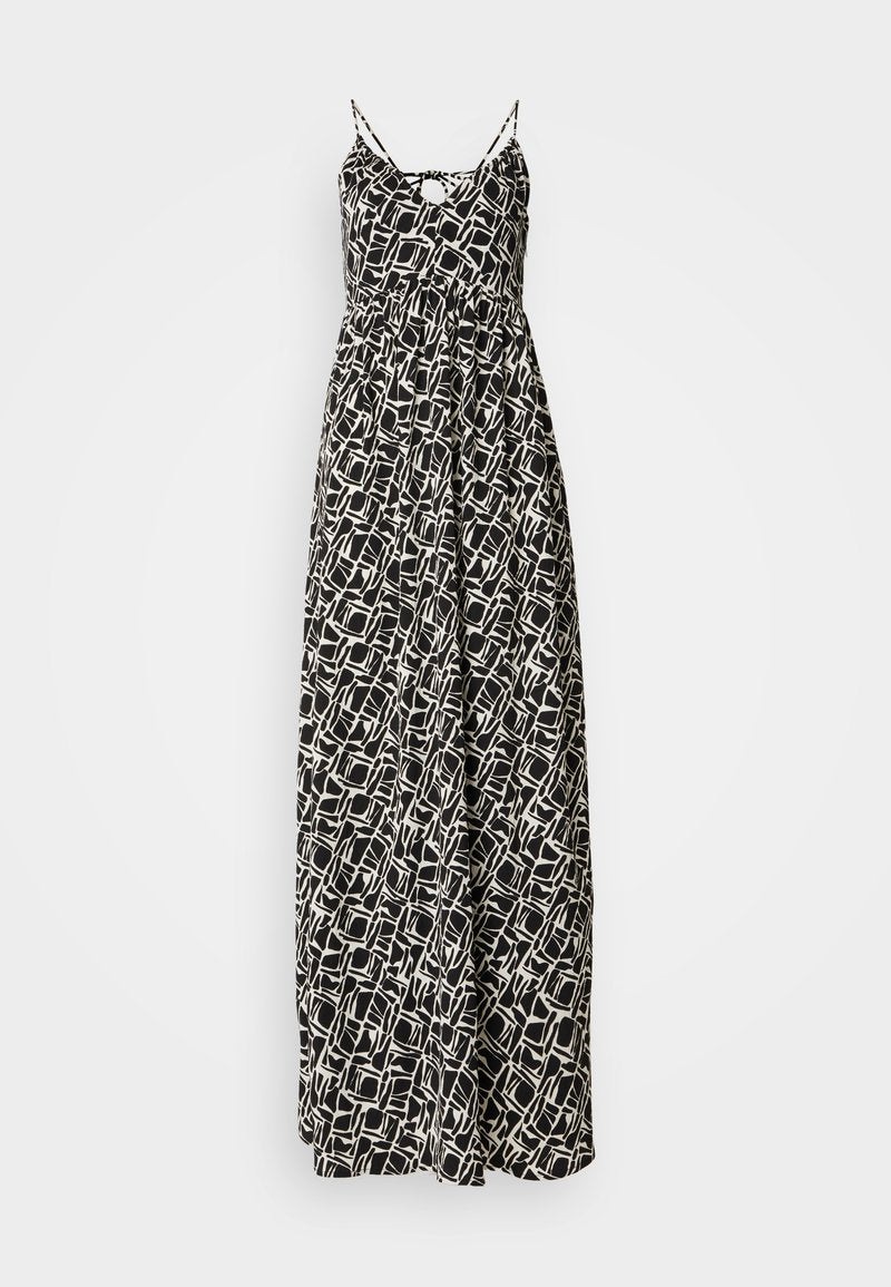Maxikleid in Schwarz und Weiß mit geometrischem Muster, ausgestattet mit dünnen verstellbaren Trägern und einem lockeren Schnitt, aus leichtem Stoff gefertigt.