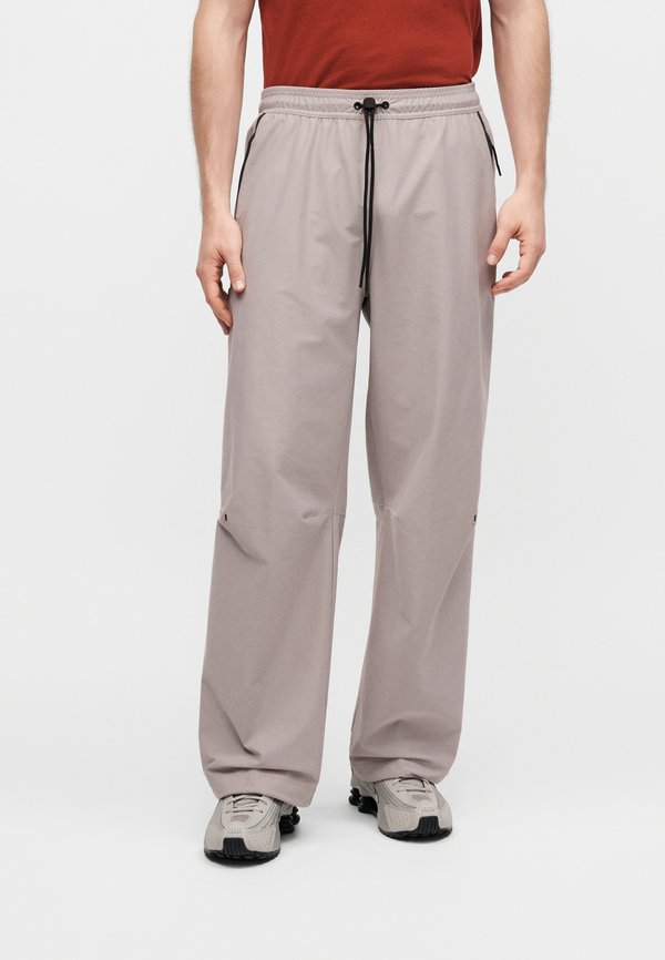 Nike Sportswear Tracksuit bottoms - college grey/black