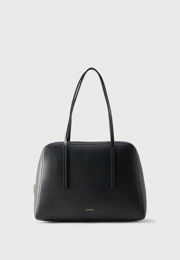 Calvin Klein FOIL LOGO BOWLING BAG - Tote bag - black/toasted coconut