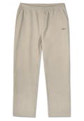 Beige Jogginghose aus weichem Stoff, mit einem elastischen Bund, zwei Seitentaschen und einem kleinen Logo auf der linken Seite.