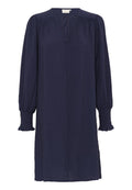 Marineblaues Kleid mit langen, luftigen Ärmeln und gesmokten Manschetten. Verfügt über einen V-Ausschnitt und eine Bindeschleife am Ausschnitt. Hergestellt aus strukturiertem Stoff.