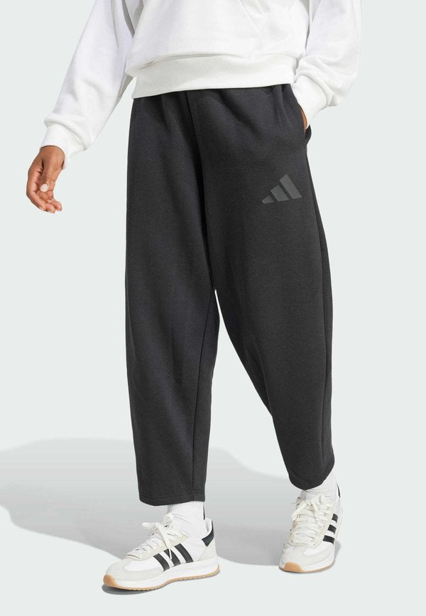 adidas Sportswear ESSENTIALS CONTEMPORARY FLEECE BARREL LOOSE - Tracksuit bottoms - black