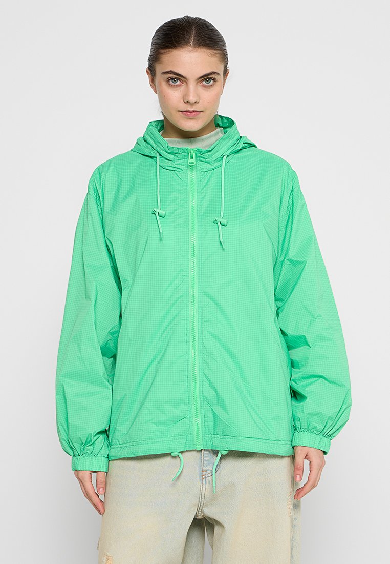Leichte, kapuzenjacke in leuchtendem Grün mit kariertem Muster, ausgestattet mit Kordelzugverstellungen, elastischen Bündchen und einem Reißverschluss vorne.