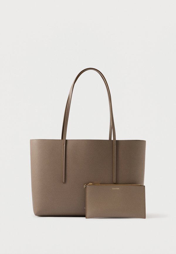 Calvin Klein FOIL LOGO TOTE POUCH - Tote bag - desert taupe