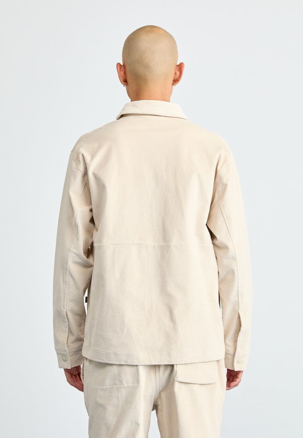 New Balance OVERSHIRT
