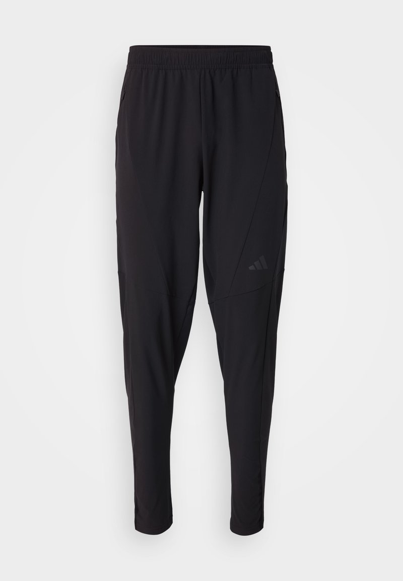 Schwarze Sporthosen mit elastischem Bund, tailliertem Design, Seitentaschen und dezenten Logo-Details. Hergestellt aus flexiblem, atmungsaktivem Material.