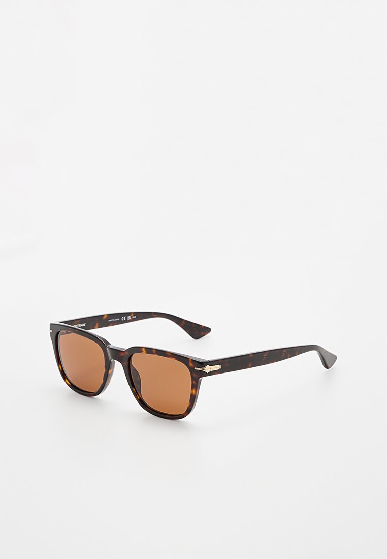 Rechteckige Schildpatt-Sonnenbrille mit braunen Gläsern und einem metallischen Akzent am Bügel, auf einer weißen Oberfläche präsentiert.