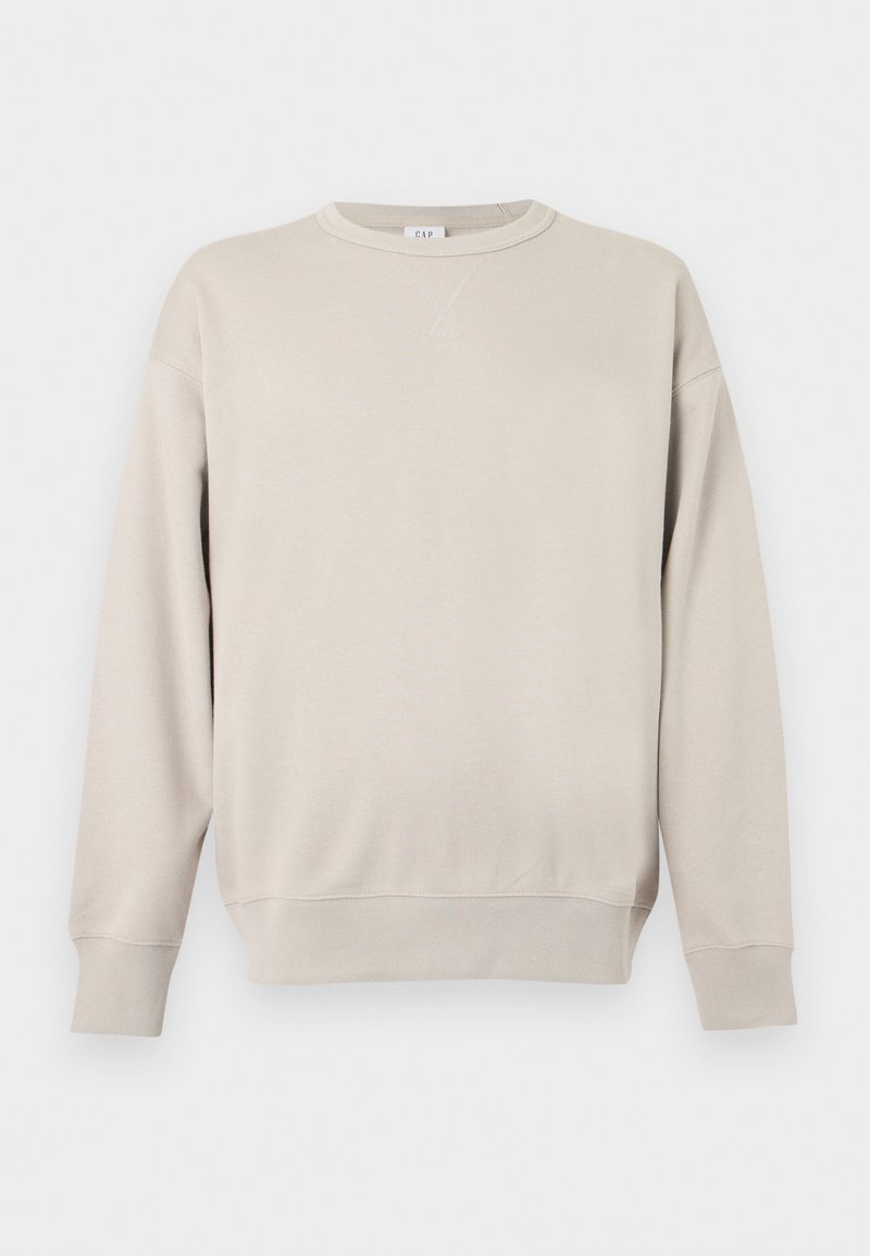 Beiges Sweatshirt mit Rundhalsausschnitt, langen Ärmeln, gerippten Bündchen und Saum sowie einem kleinen, eingenähten Dreieck unterhalb des Halsausschnitts.