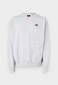 Helles graues Langarm-Sweatshirt mit gerippten Bündchen und Saum, ausgestattet mit einem kleinen Tommy Jeans Logo-Patch auf der Brust.