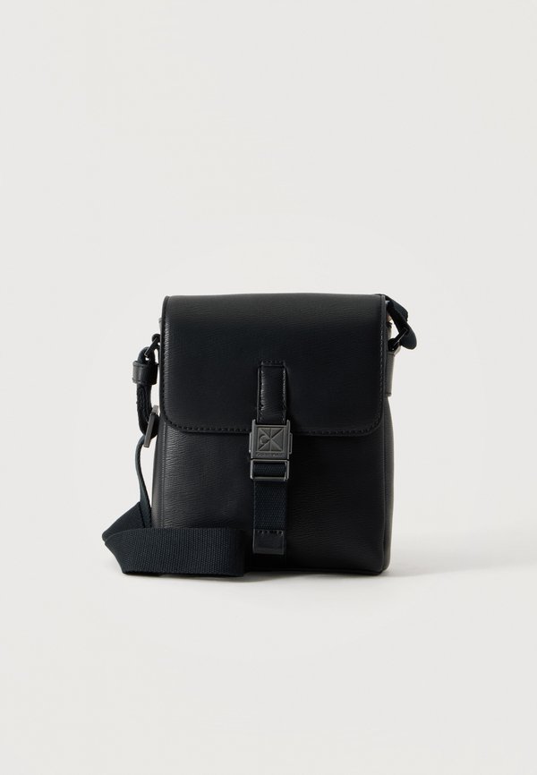Calvin Klein REPORTER - Cross body bag - black